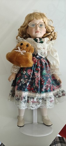 Porcelain doll stand with - doll, on